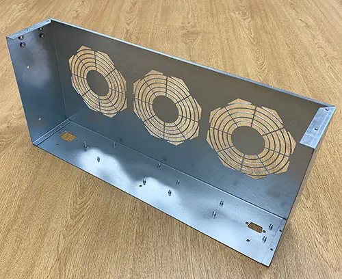 Custom enclosure top cover fitted with all required inserts. 